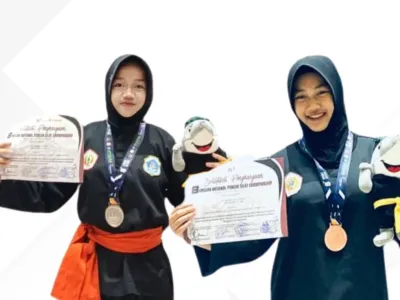 DUA SRIKANDI SMP NEGERI 1 SUGIO TOREHKAN PRESTASI NASIONAL PADA KEJUARAAN PENCAK SILAT UMSURA CHAMPIONSHIP 2026